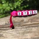 Telefoninumbriga käepael roosa roosiga 